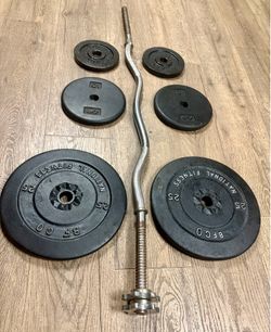 Standard Curl Bar with Cast Iron Weight plates: 25s, 10a and 5s. Total: 97 lbs