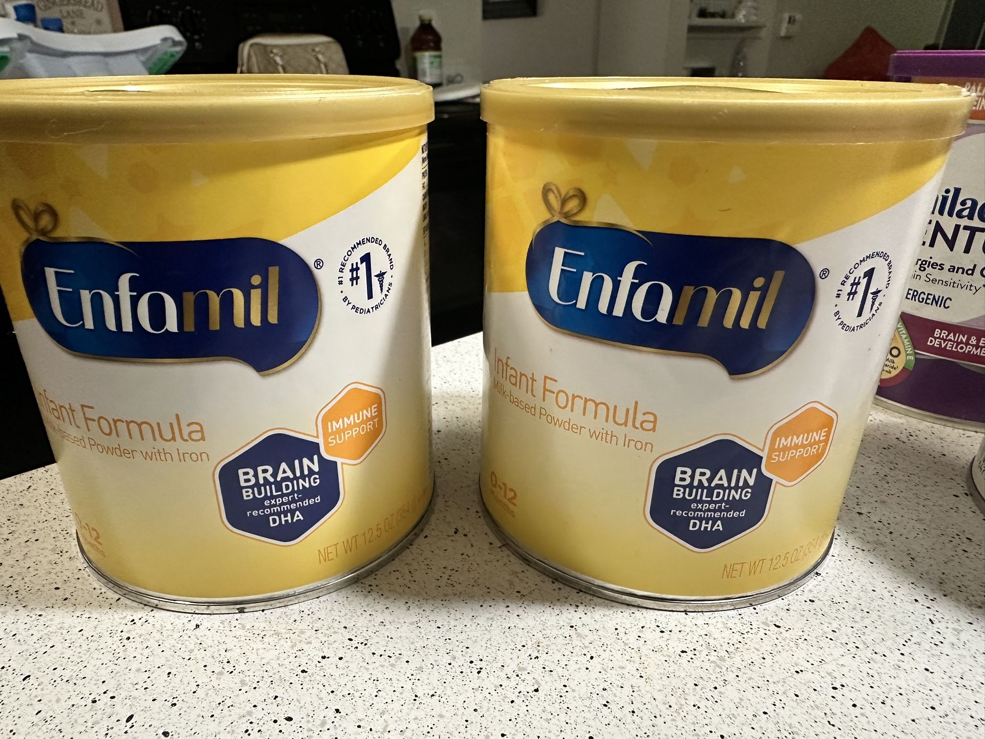 Yellow Enfamil Cans