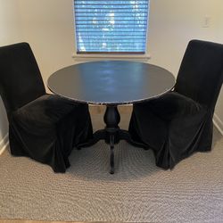 42” round Dining table and 2 Velvet Parsons chairs