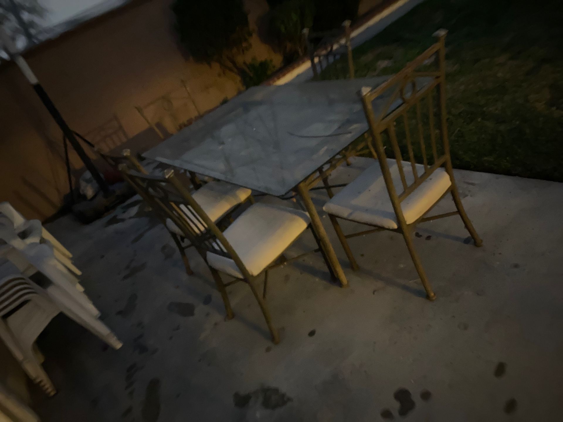 Free table and 5 chairs been outside need cleaning