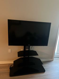 TV stand and 43in Tv