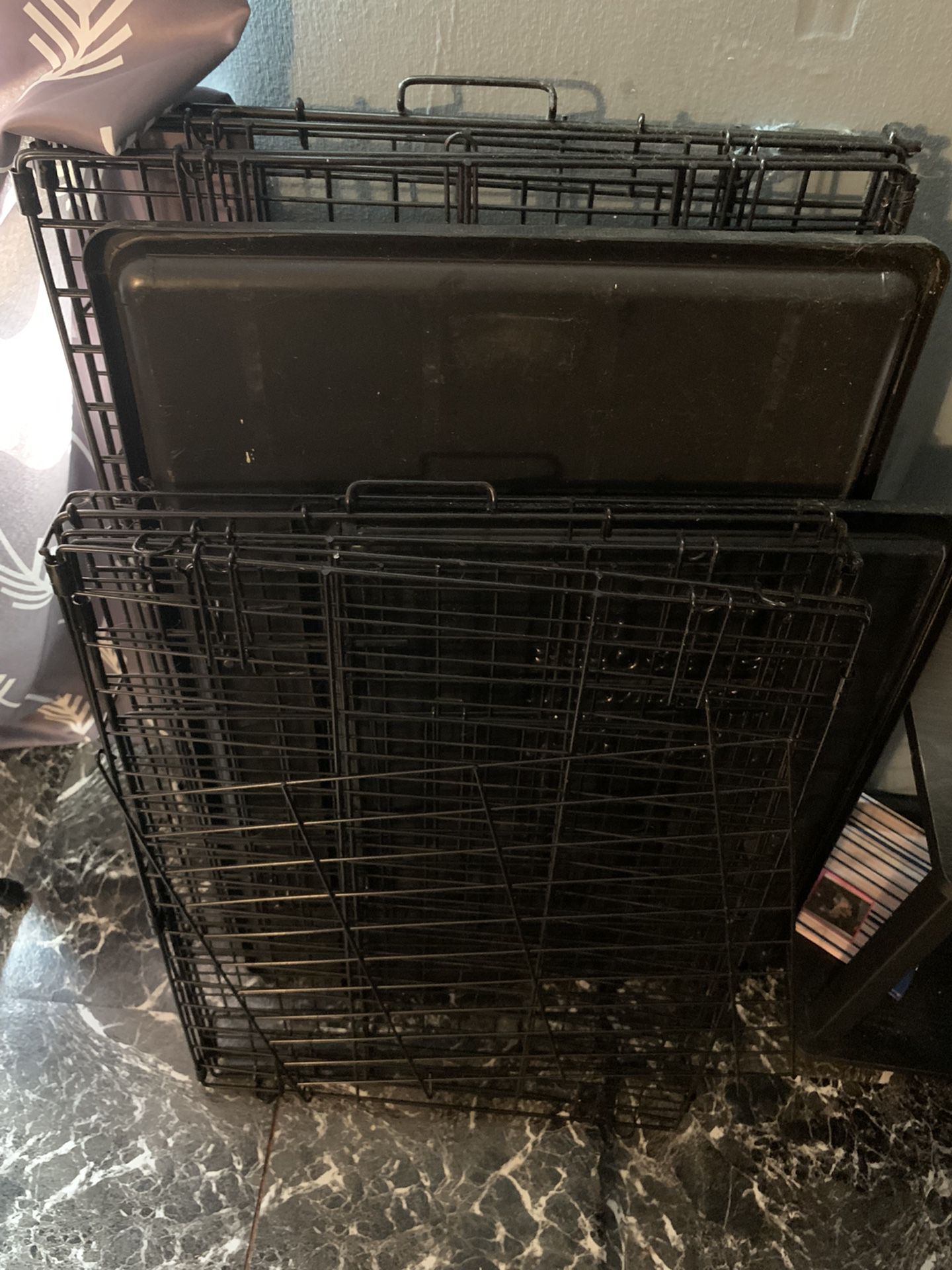 2 Dog Cages. One Smaller One Medium.  Do Not Know Exact Measurements . 