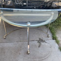 Modern contemporary entry glass and silver metal rounded table