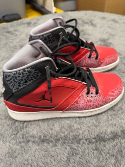 Jordan Flight 45 High Red Elephant Print Shoes in Youth 7.  Nike Vibrant red Jordan Flight 45 High sneakers with black and grey elephant print overlay