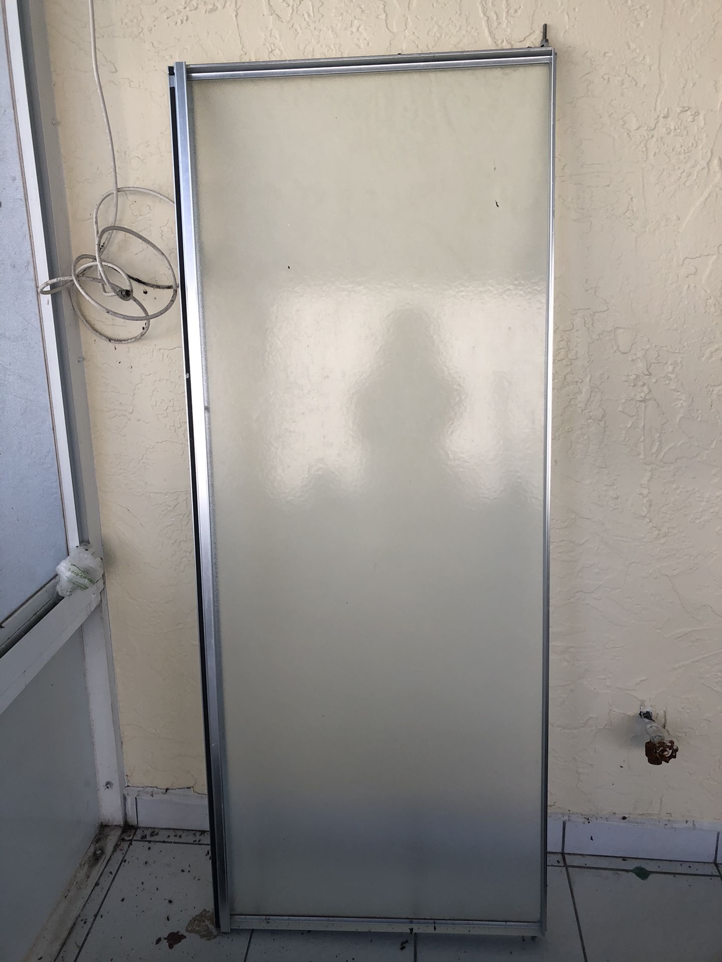 Shower door 57.5 inches high 22.5 inches wide