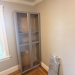 Gray Bookshelf With Glass Doors 