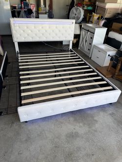 White Tufted Platform Bed Frame with LED Headboard and footboard remote . $180 I put together myself