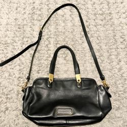 Marc by Marc Jacobs shoulder bag with crossbody strap. Retail $498. Black bag with gold medal details. Adjustable strap. Great condition!