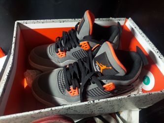 Air Jordan 4 Retro "Infrared" sneakers, featuring a multi-tonal grey nubuck upper accented with bright infrared-okicks/air-jordan-4-infrared-where-to-