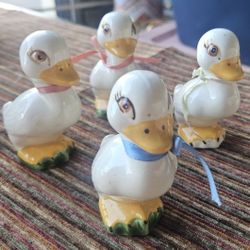 The image features four Homco ceramic duck figurines Signed By Lavaughn