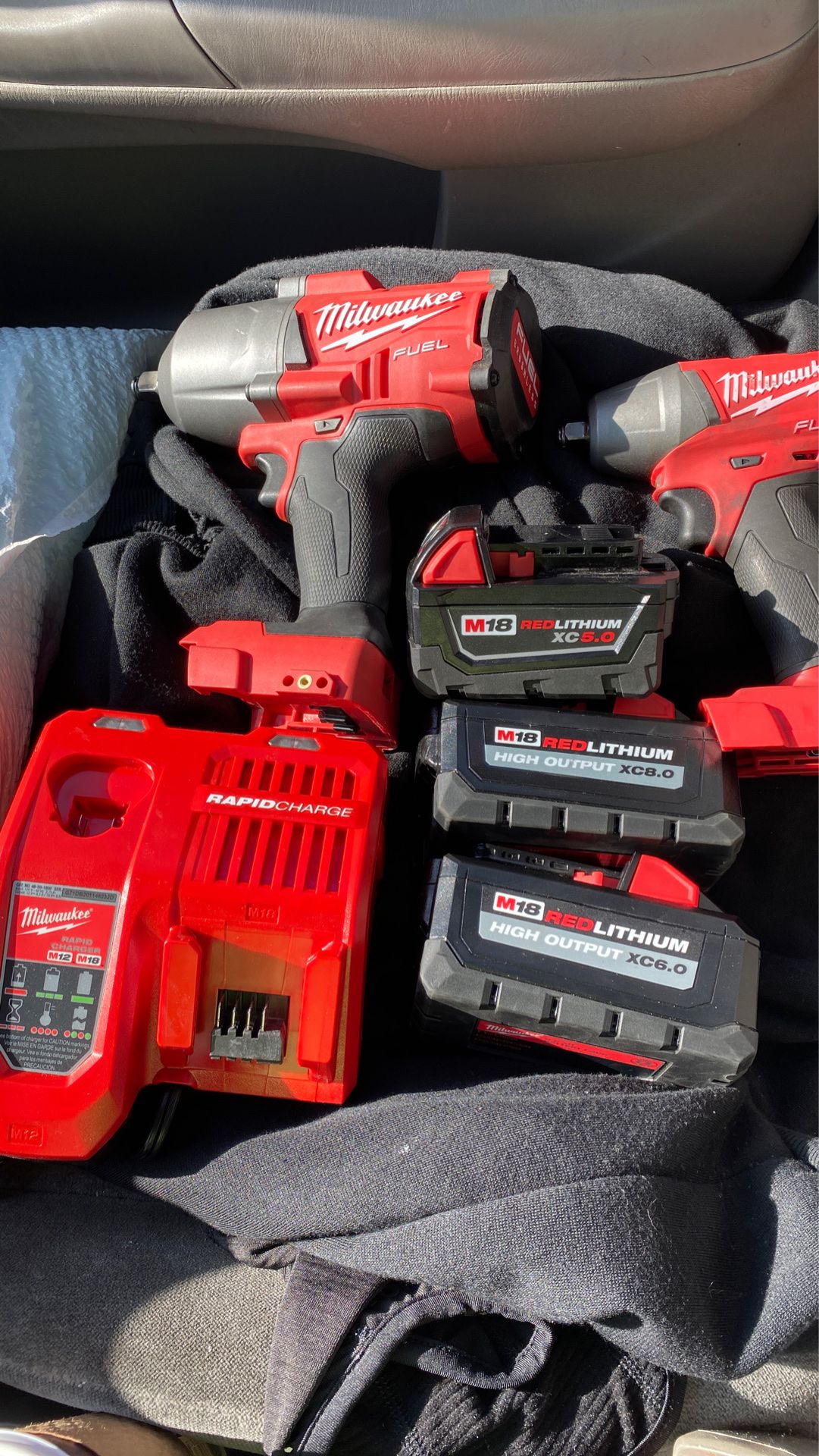 Milwaukee fuel 1/2 and 3/8 impact wrench and 3 batteries and rapid charger