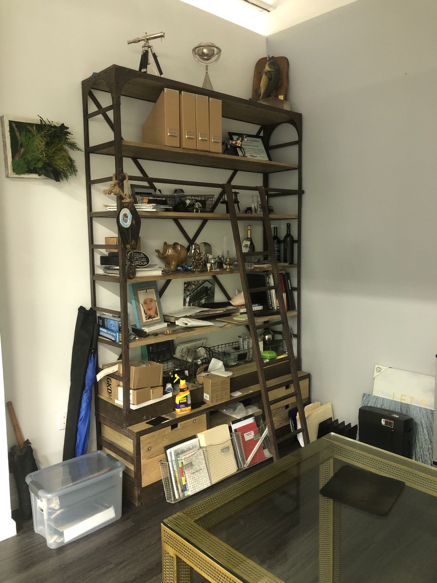 Rod iron and wood wall shelf unit with ladder.