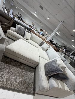 Rawcliffe Grey 3pc Sectional + Ottoman