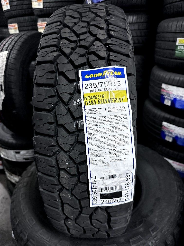 SET OF NEW 235/75/15 GOODYEAR WRANGLER TRAILRUNNER AT INCLUDING MOUNT AND BALANCE 