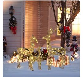For sale: a set of three gold LED reindeer lights, perfect for Christmas decorations in patios, doorways, lawns, and indoors.