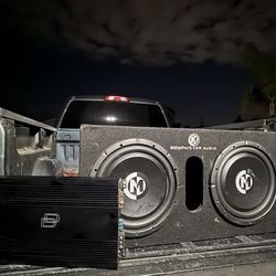 Two 12-inch speakers and an amplifier