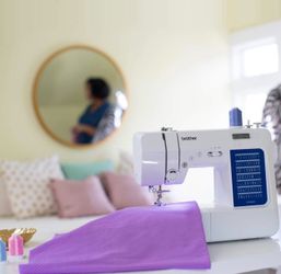 Brother CS7000X Computerized Sewing and Quilting Machine, 70 Built-in Stitches, LCD Display, Wide Table, 10 Included Feet, White
