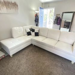 White Leather Sectional Couch And Ottoman