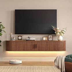 63" Floating TV Stand with Power Outlet for TVs up to 75", Walnut