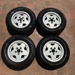 OEM 14 “ Volkswagon Alloy rims with Hancock Winter Studded Tires 