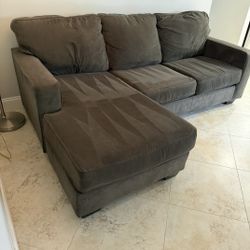 Ashley Furniture Sofa/Chaise lounge combo dark Grey 
Read description for details 