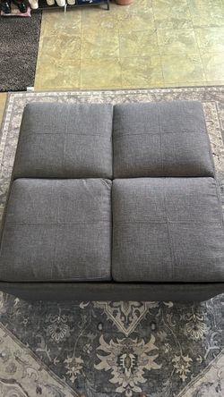 Grey ottoman with storage