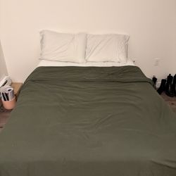 Bed With Sheets, Blankets, And Pillows