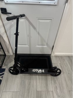All black scooter with big wheels