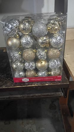 Brand new holiday time 40 shatterproof ornaments 40 piece silver and gold firm price $10 for hole pk pick up only 865 Ellsworth avenue right off of Ea