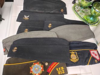 Nine assorted caps with emblems vintage
