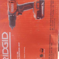 Brand New Ridgid Drill With Bat And Chgr