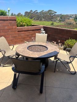 Beautiful outdoor patio set with fireplace table