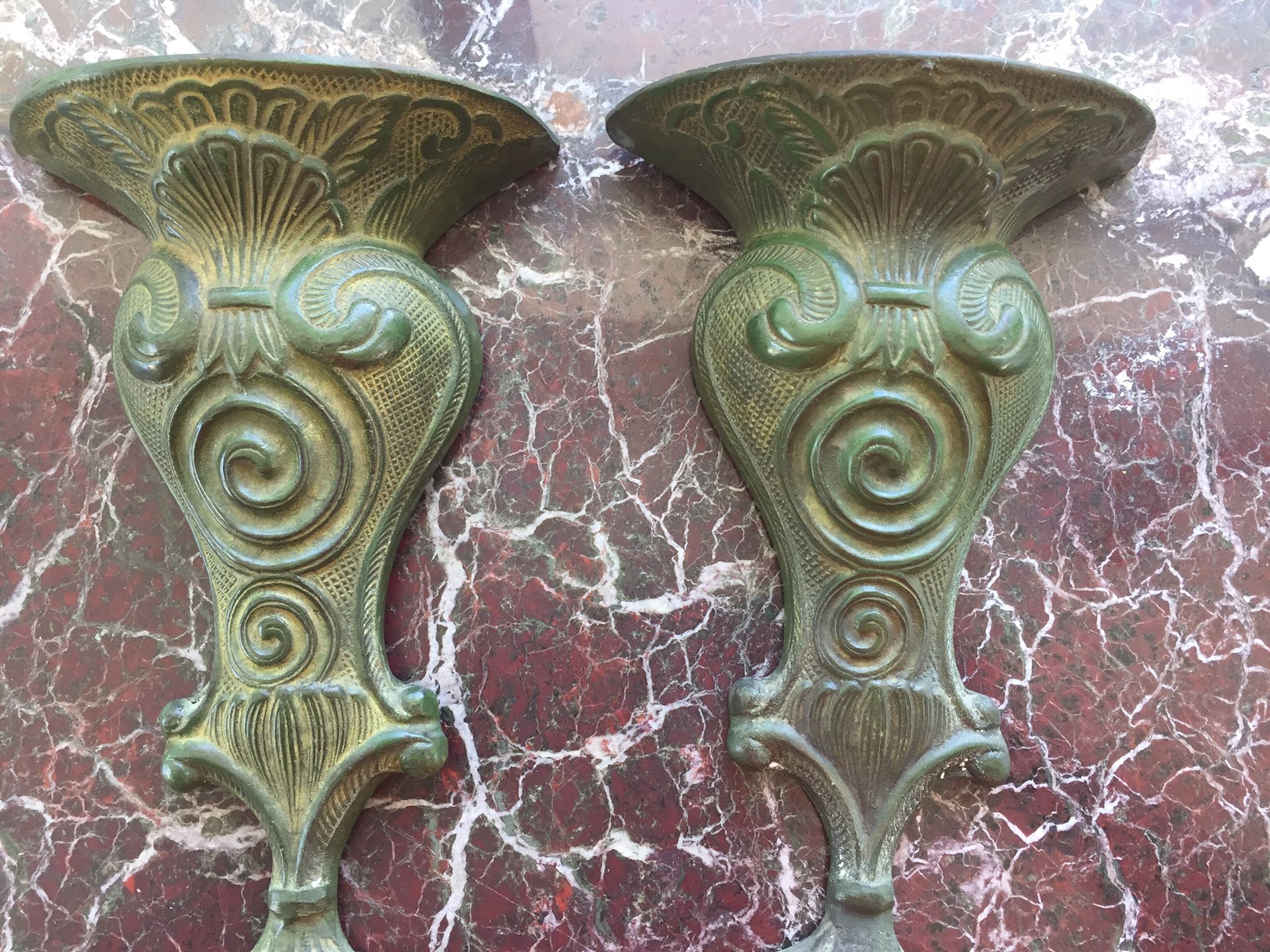 Pair of wall pockets/vases made of brass with a beautiful green patina. 11”x7” ideal for flower arrangement.