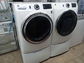 GE front load washer and dryer set on pedestals - Free delivery