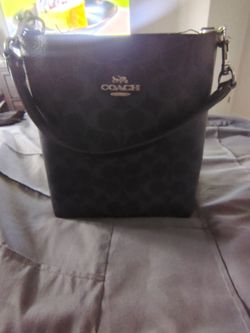 Black leather coach bucket bag
