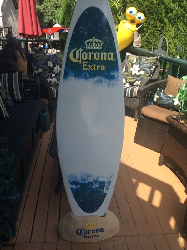 Corona beer display surfboard with stand