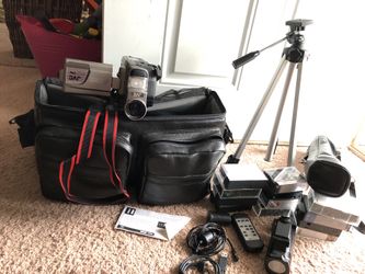 Incredibly beautiful JVC compact VHS camcorder with big padded bag,12 VHS Cassettes, remote control, tripod with its bag, two films.