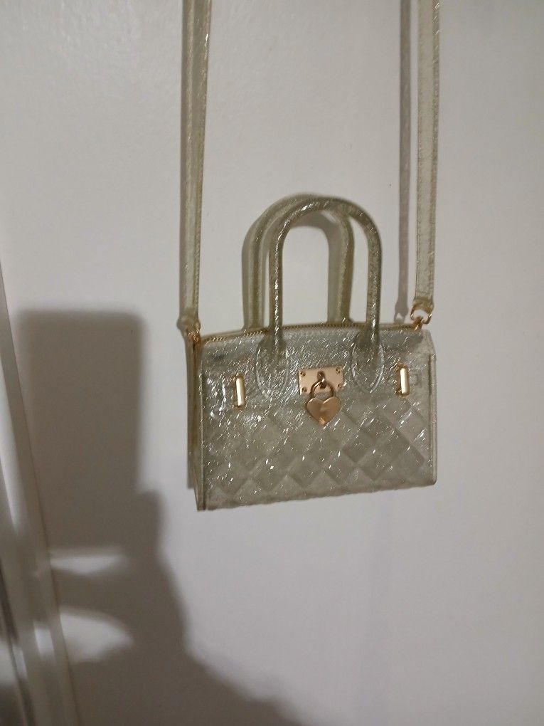 Cute Heavy Plastic Hand Bag. Pethaps For A Child. Removable Strap. Silver Colored. New. Never Used