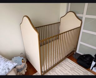 Gold baby crib/converts to toddler bed