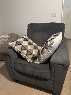 Sofa chair with pillows
