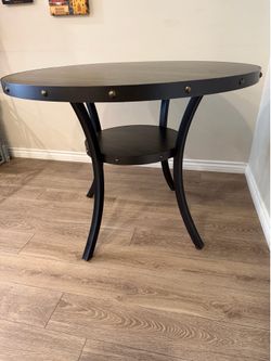 Round wood and metal industrial dining table