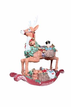 Vintage rocking reindeer Christmas figurine featuring a decorative holiday wreath and a basket-riding figurine.