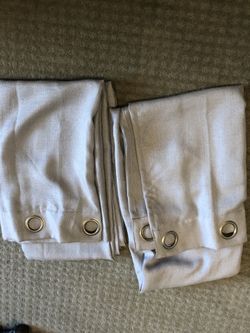 Gray fabric curtain panels