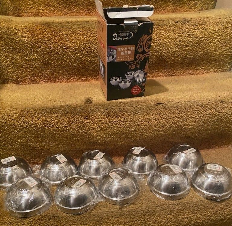New, 10 double layered stainless steel bowls. 
