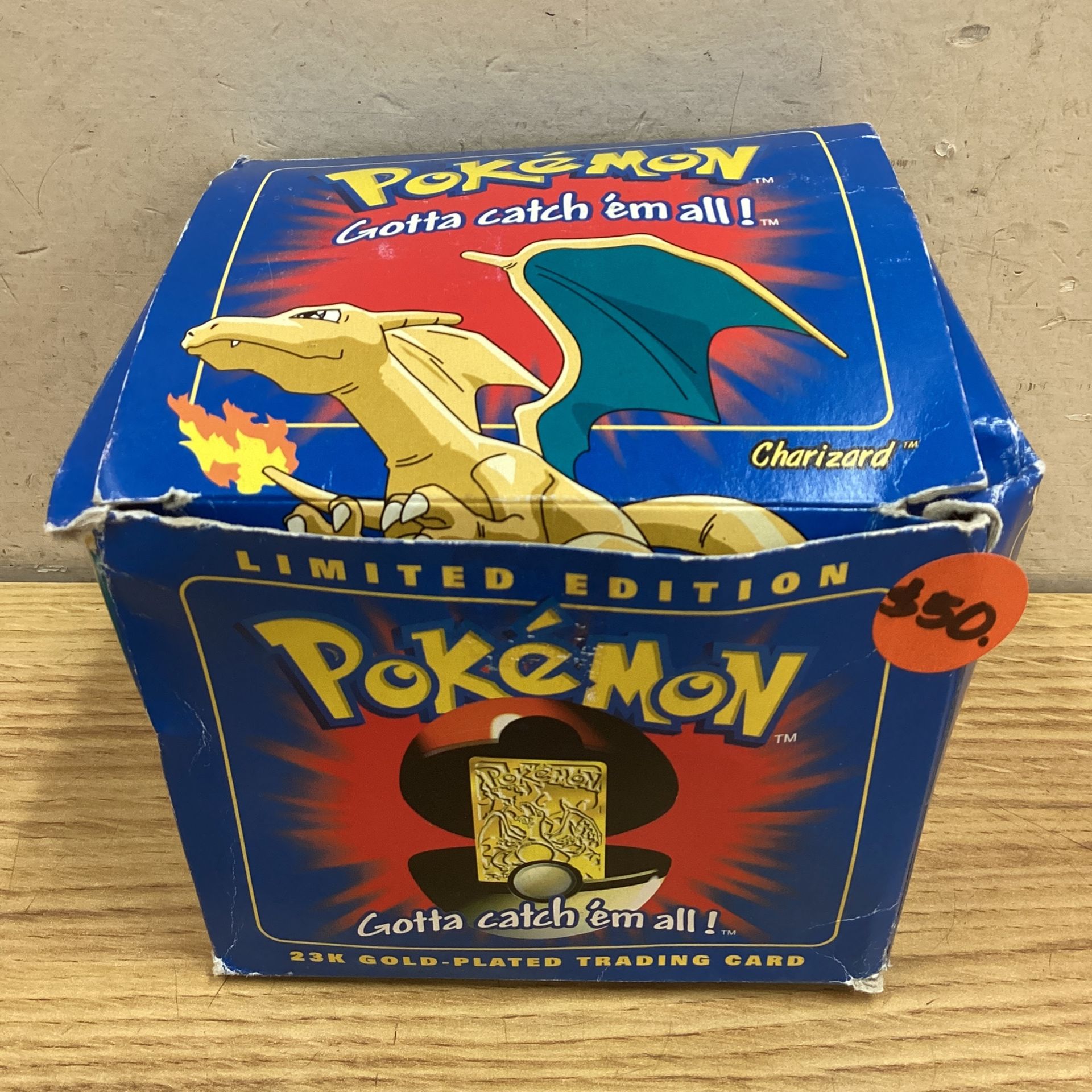 LIMITED EDITION POKÉMON CHARIZARD 23K GOLD-PLATED TRADING CARD.