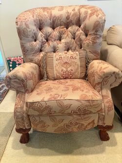Floral wingback recliner with claw feet
