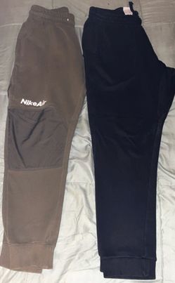 Black and green Nike joggers