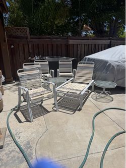 Pool chairs and 2 tables