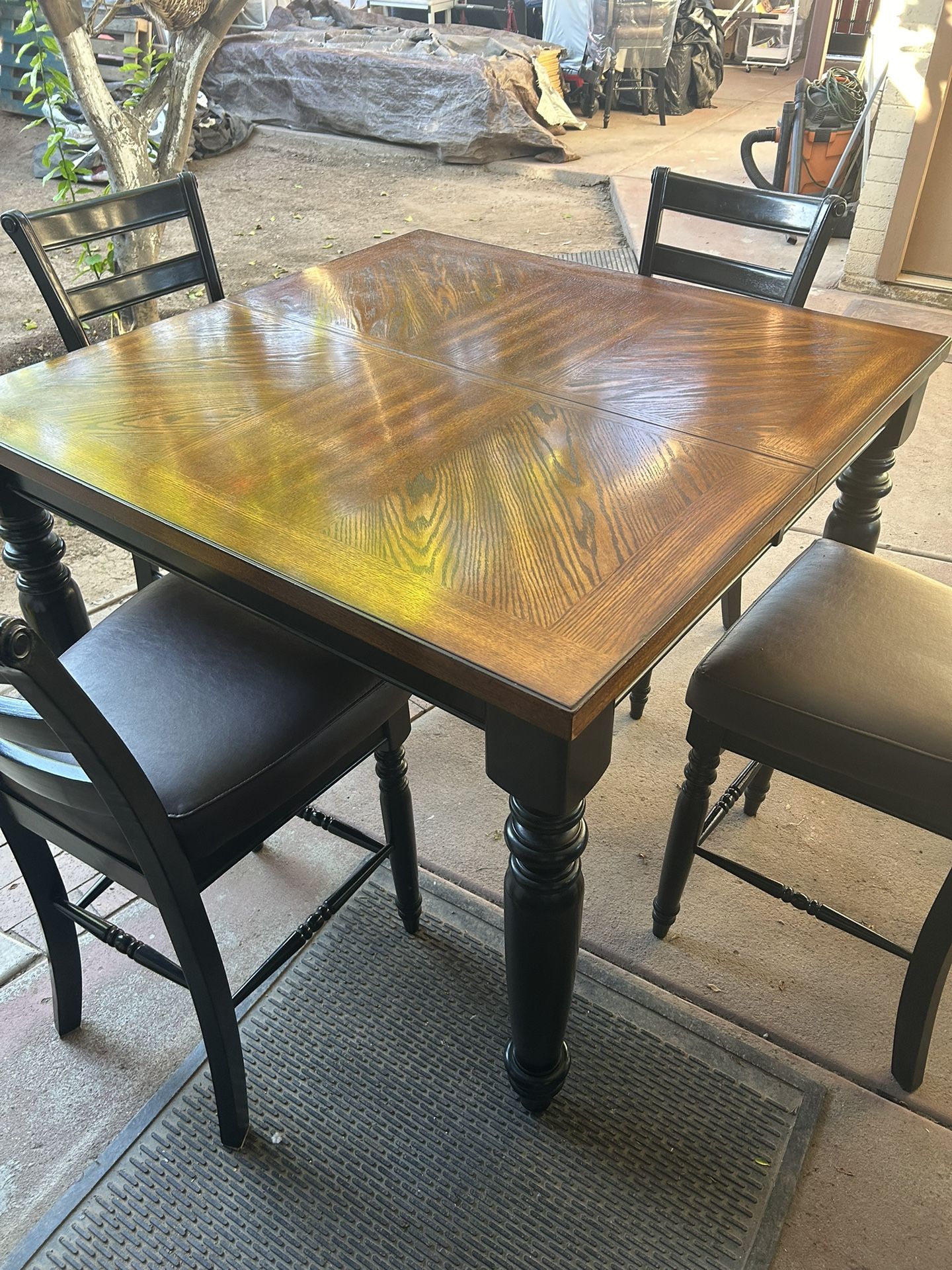 Beautiful Solid Wood High 4x4  Table With 6 Padded Chairs Table Has 18” Middle Extension Makes It 5 Ft 6” For Larger Table Great Conditions 