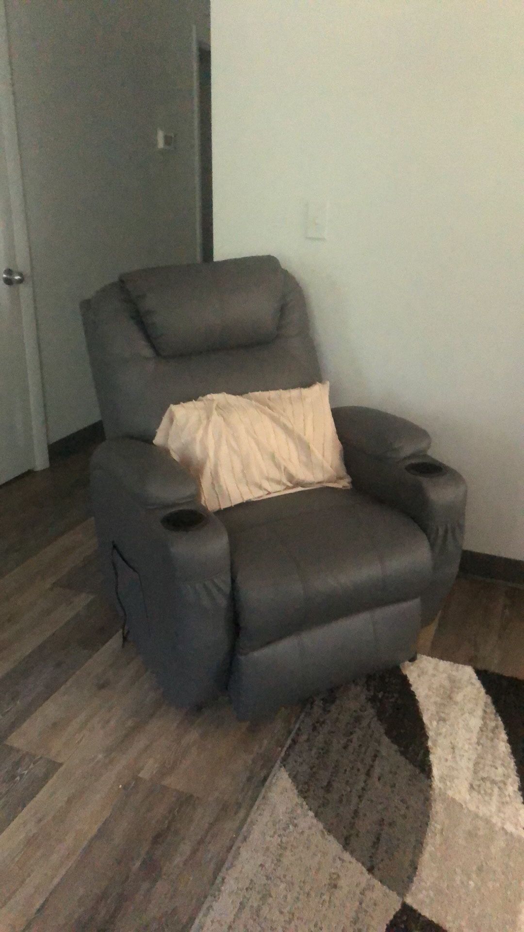 Gray leather reclining massage. He’s also a Lyft.